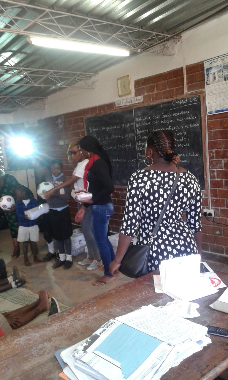Thankful Thinking making the donation to Mulele Mwana Community School, Lusaka,Zambia