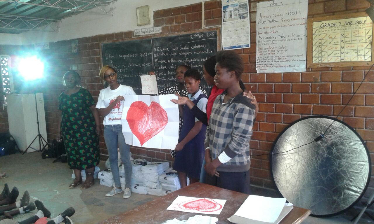 Thankful Thinking making the donation to Mulele Mwana Community School, Lusaka,Zambia